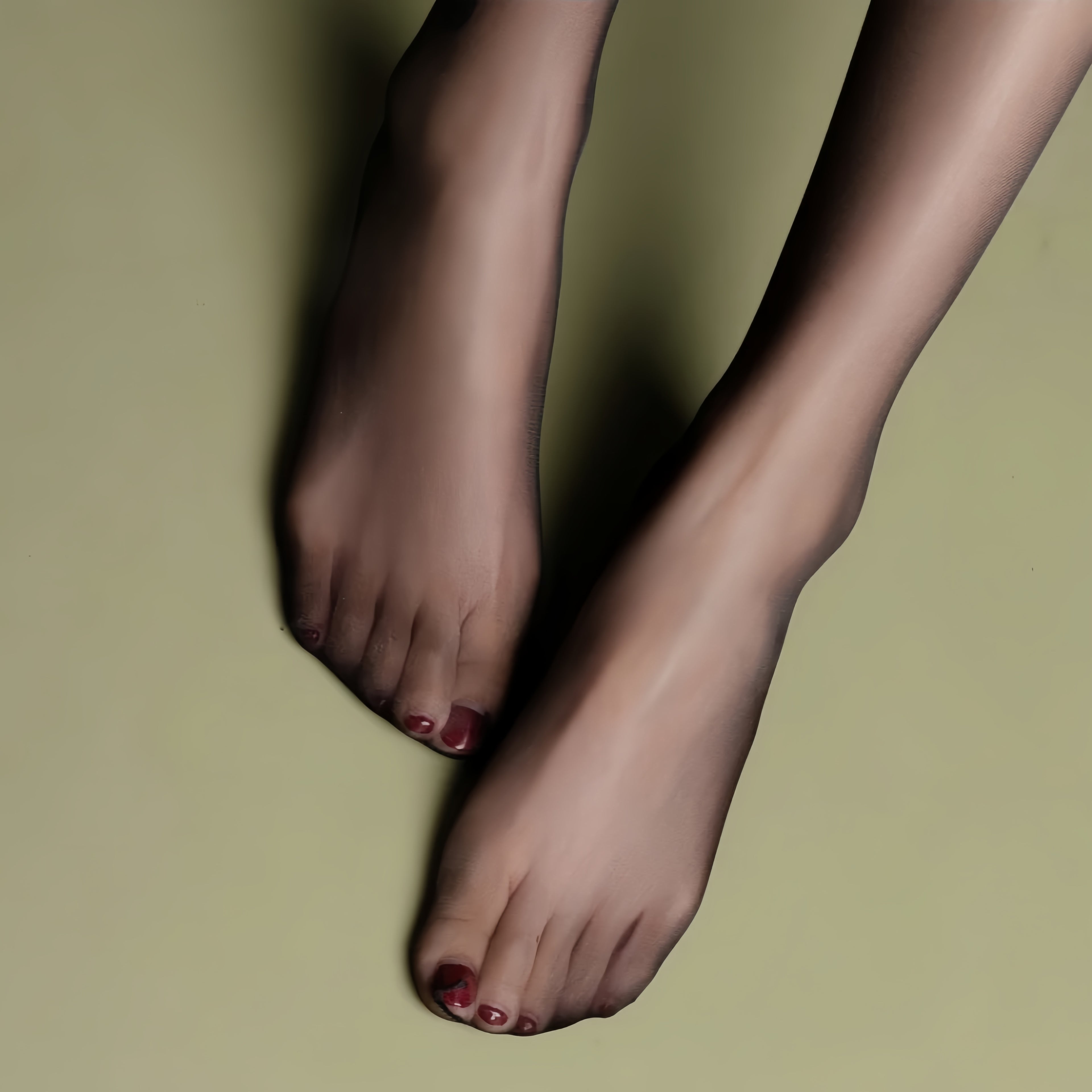 Close-up of black seamless tights showing silky ultra-sheer fabric