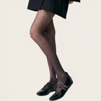 Elegant woman wearing ultra-sheer nylon tights with smooth texture and natural matte finish, lightweight pantyhose for everyday comfort and refined style.