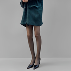 Elegant woman wearing ultra-sheer nylon tights with smooth texture and natural matte finish, lightweight pantyhose for everyday comfort and refined style.