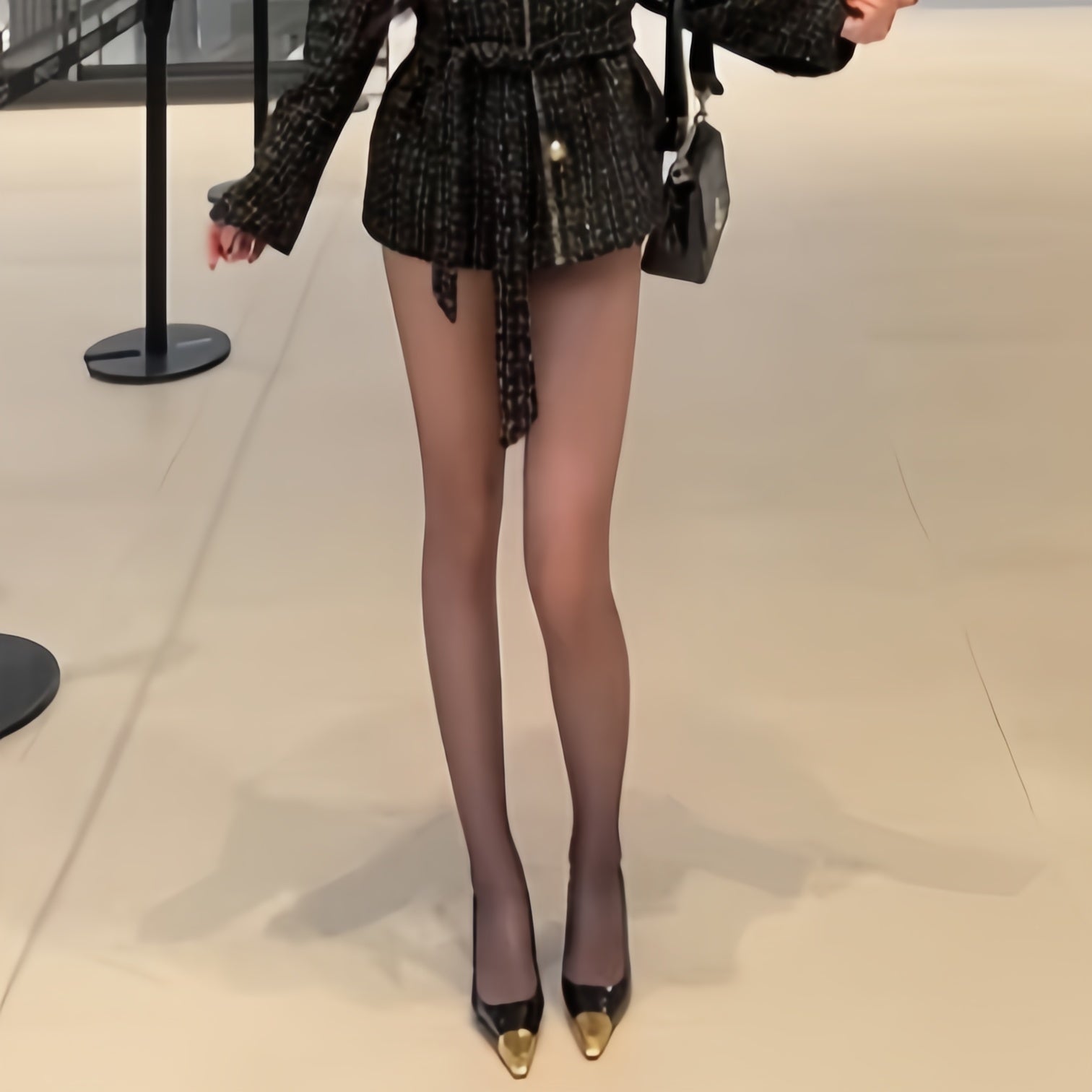 Elegant woman wearing ultra-sheer nylon tights with smooth texture and natural matte finish, lightweight pantyhose for everyday comfort and refined style.