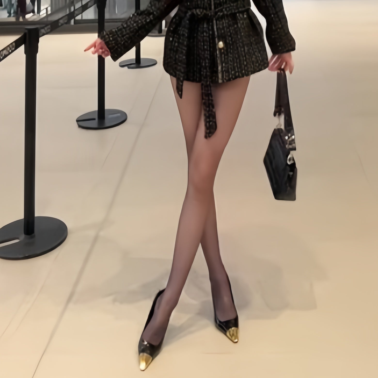 Elegant woman wearing ultra-sheer nylon tights with smooth texture and natural matte finish, lightweight pantyhose for everyday comfort and refined style.