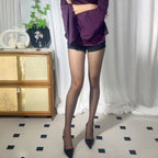 Premium ultra-sheer tights flat lay on clean background, transparent pantyhose made of nylon and elastane blend, minimal and elegant design.