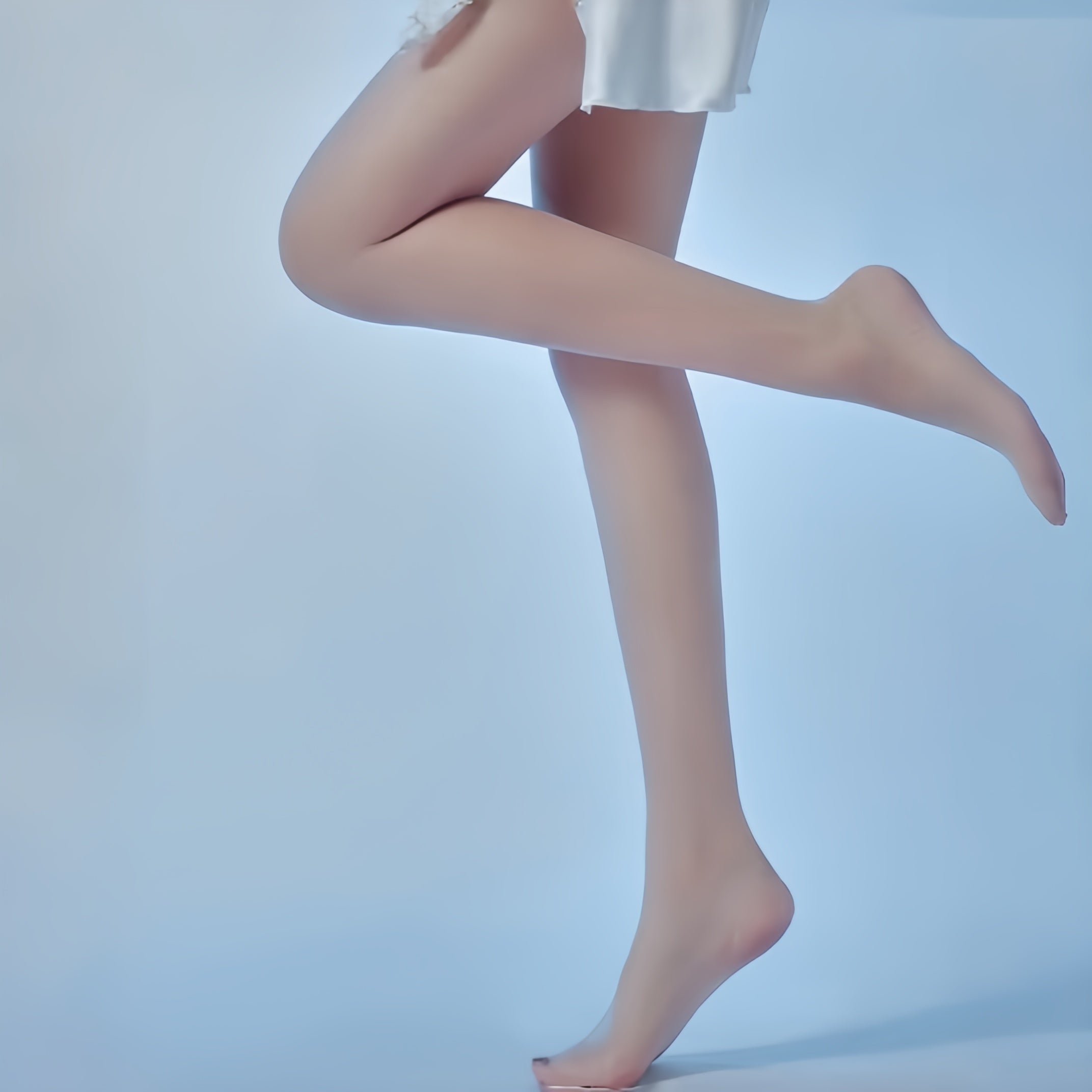 Stylish outfit featuring sheer pantyhose paired with skirt and heels, demonstrating comfort fit and versatile everyday wear.