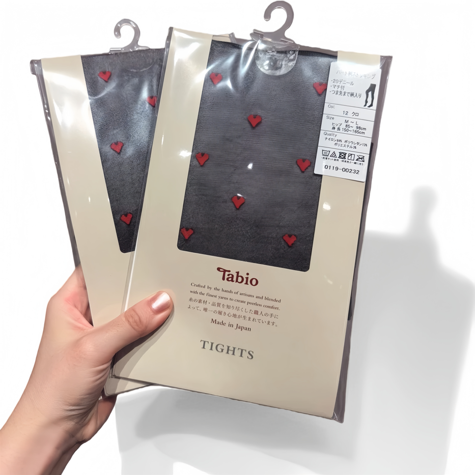 Elegant packaging of sheer nylon tights with product label and care instructions, minimal aesthetic design for online retail display.