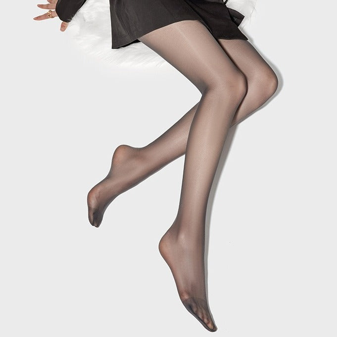 Woman sitting gracefully wearing black sheer tights