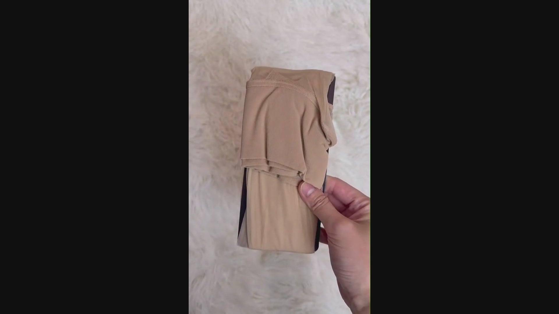 Detailed view of seamless waistband and reinforced toe design, crafted for durability, comfort, and smooth leg contour.